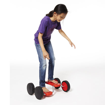 Girl riding red GONGE Go Go Roller with black wheels on white background