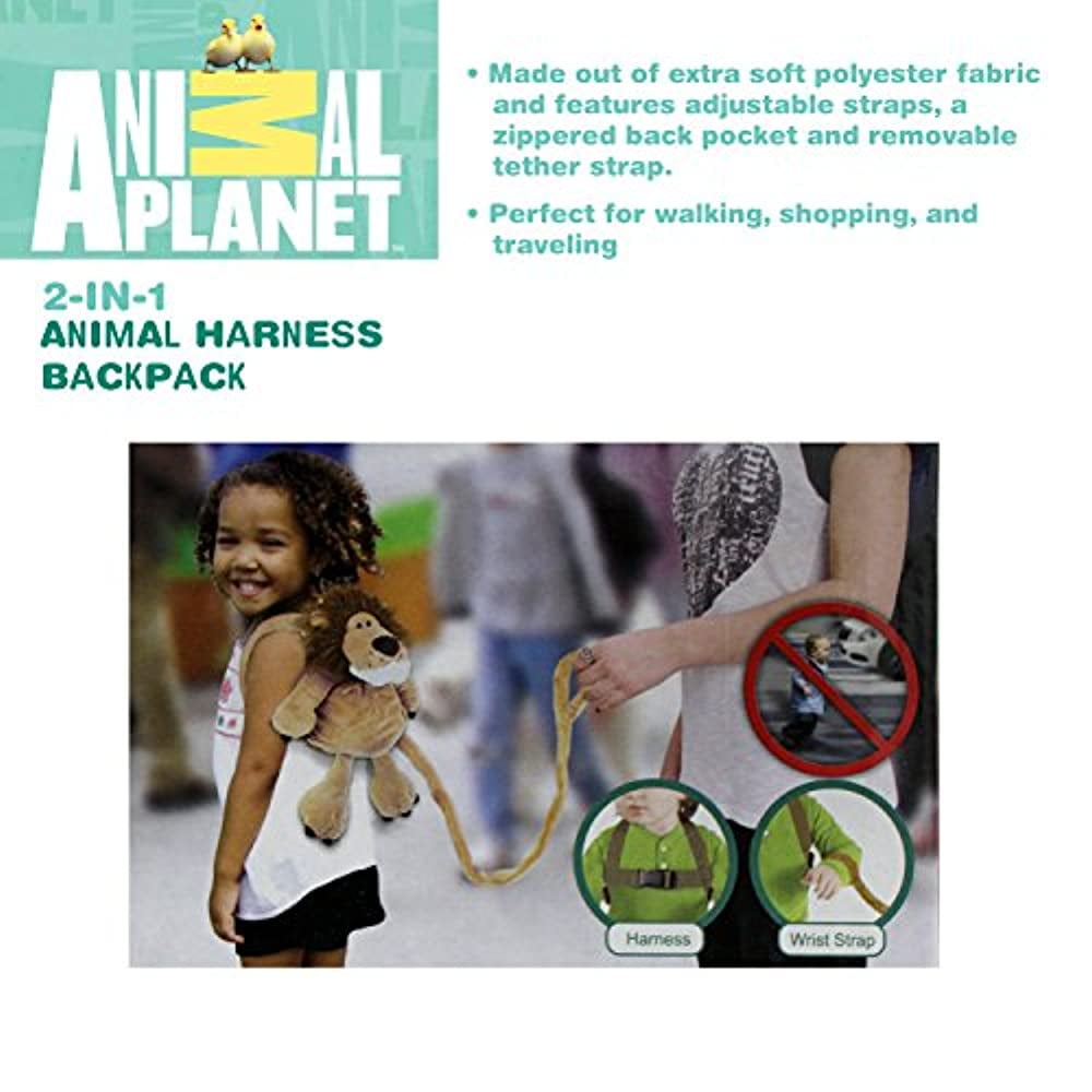 Child modeled by a child wearing tan giraffe harness backpack with yellow straps and wrist leash attachment