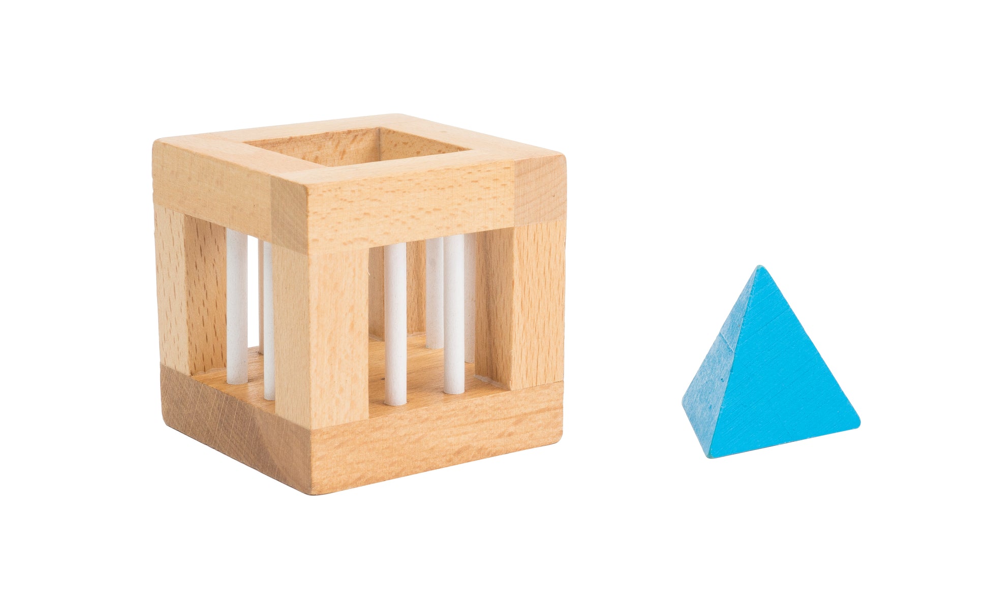 Wooden cube puzzle with white dowels and blue pyramid-shaped block on plain background