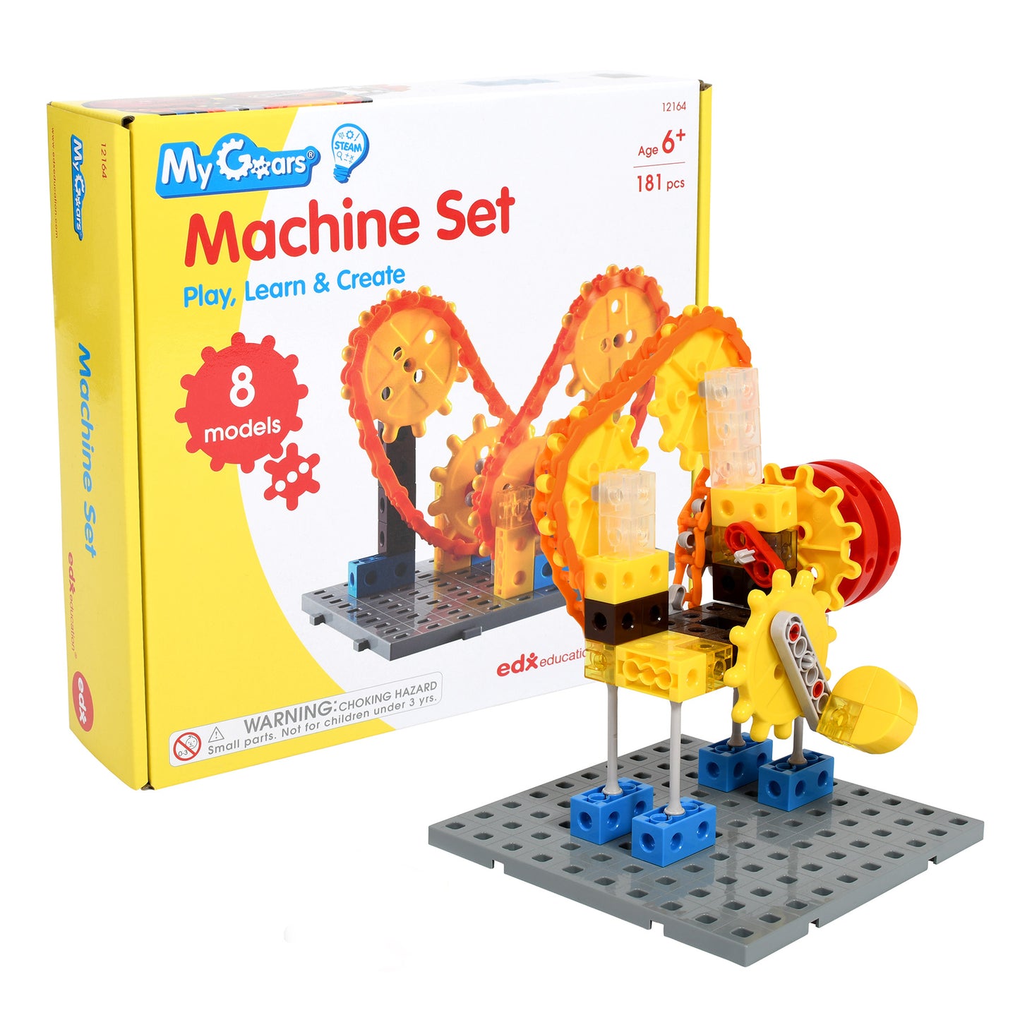 My Gears Machine Set building toy with yellow and red interlocking gears, blue base blocks, and gray platform base; box shown alongside assembled model