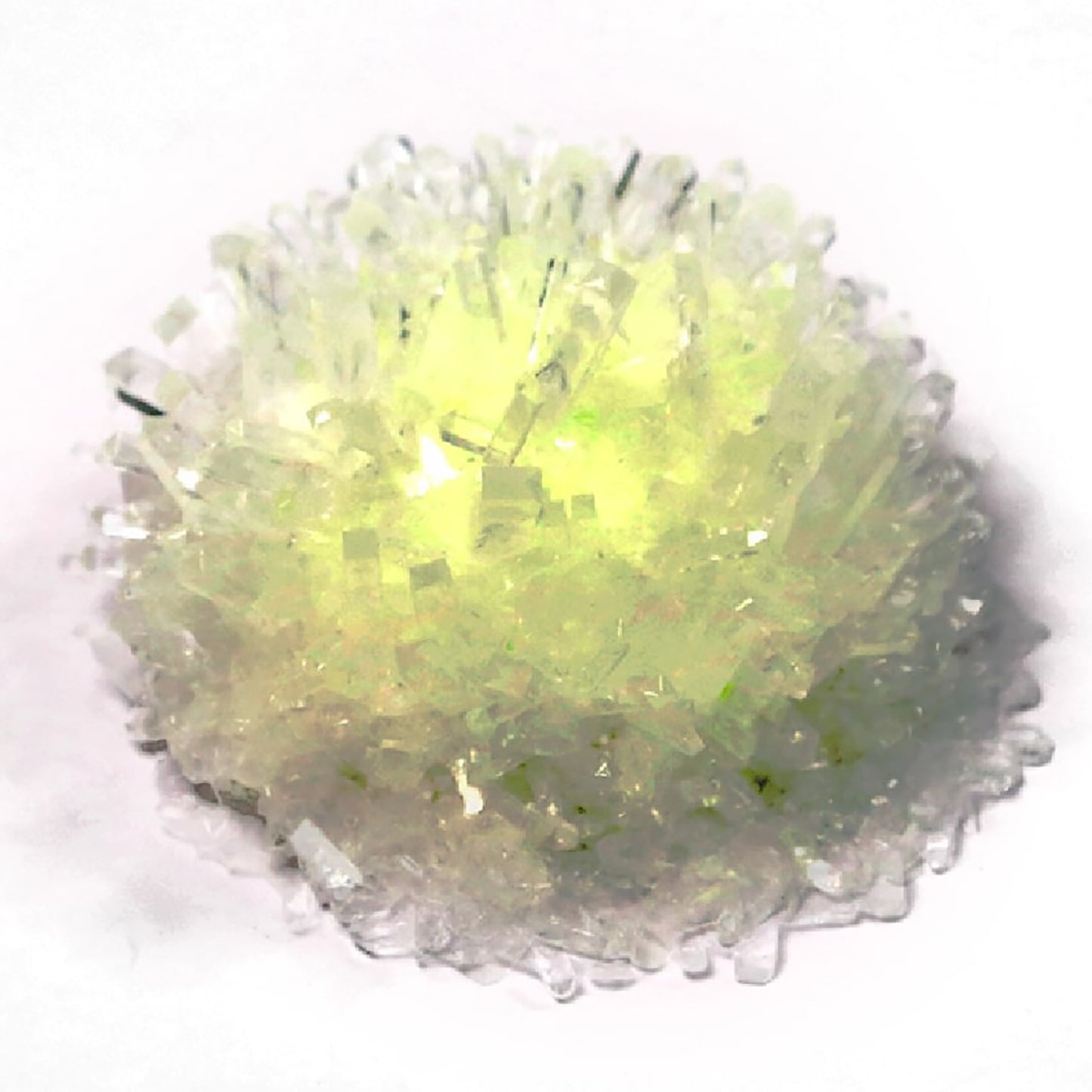 Glow Crystal Growing kit with yellow-green glowing crystals on white background