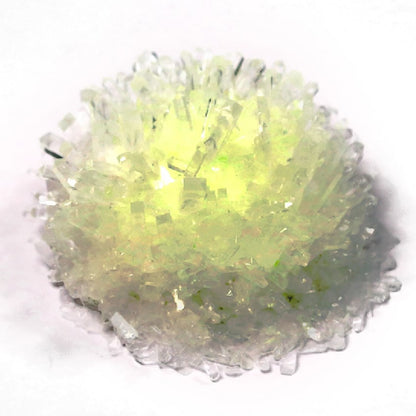 Glow Crystal Growing kit with yellow-green glowing crystals on white background