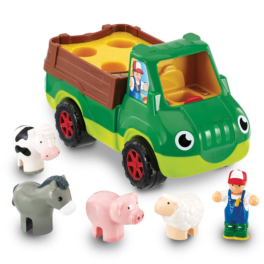 Green and yellow farm truck with brown cargo bed and large eyes, includes farmer figure, cow, elephant, pig, sheep, and lamb toy animals