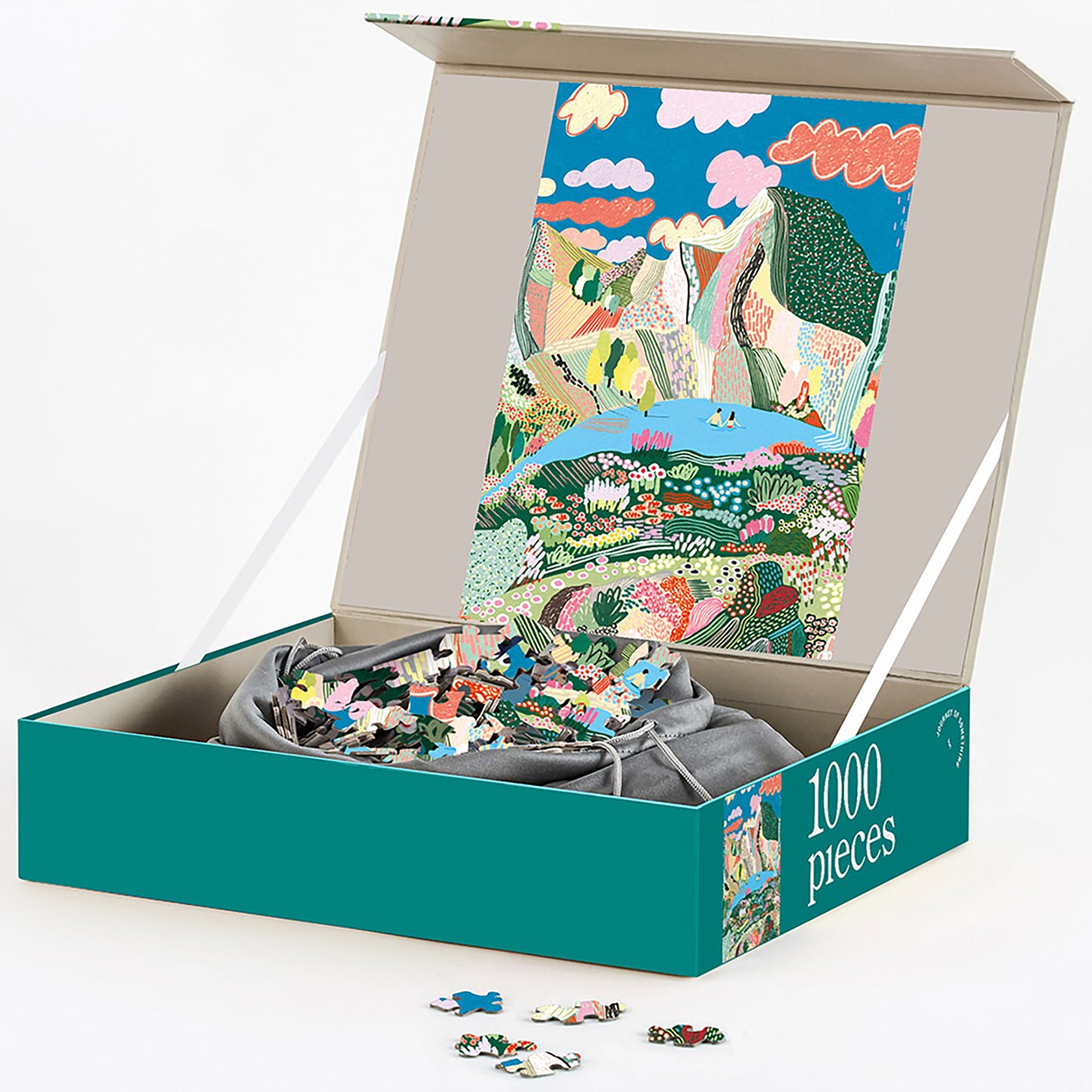 Journey of Something Laguna 1000-Piece Jigsaw Puzzle in teal box with colorful landscape illustration