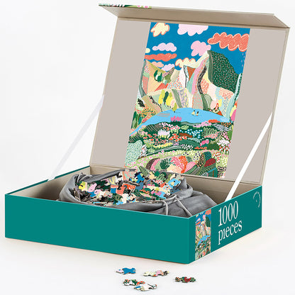 Journey of Something Laguna 1000-Piece Jigsaw Puzzle in teal box with colorful landscape illustration