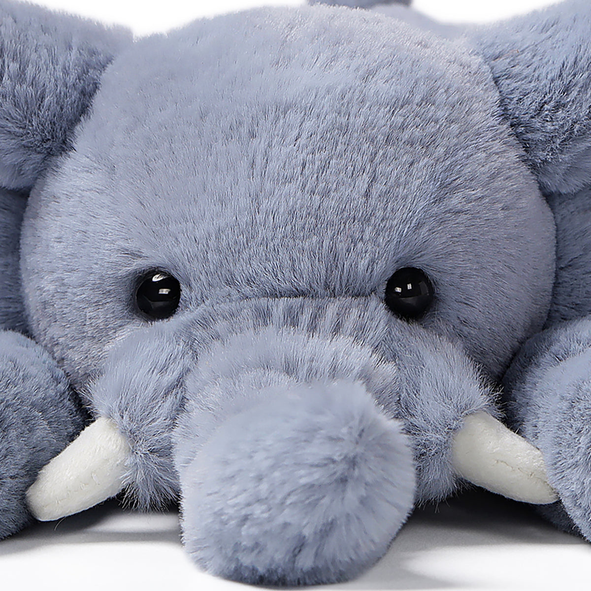 McHugs Lazy Series Elephant 7-Inch Plush with gray body, white tusks, and friendly black eyes