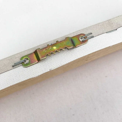 Close-up of a white zipper with iridescent metal slider on canvas art