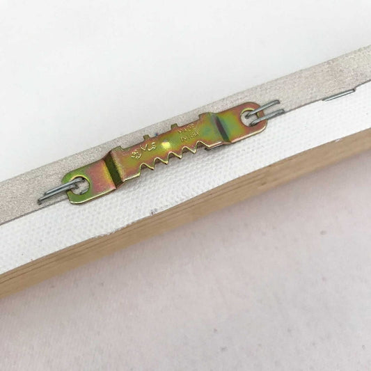 Close-up of a white zipper with iridescent metal slider on canvas art