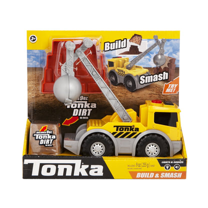 Tonka Build and Smash Crane Truck Playset with yellow construction truck, wrecking ball, crane arm, and 9 oz kinetic sand, on plain background