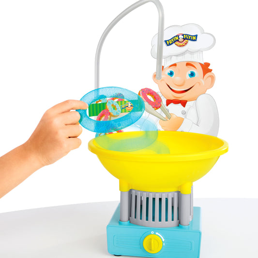 Fryin' Flyin' Donuts game modeled by a child, showing a chef character with a yellow basin, blue mesh net, and arching pole mechanism with colorful donut pieces