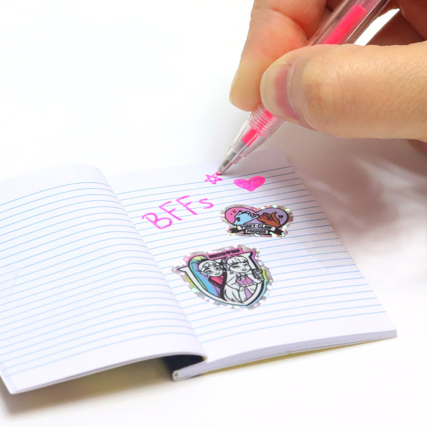 Monster High Locker Activity Set with pink gel pen writing on lined notebook
