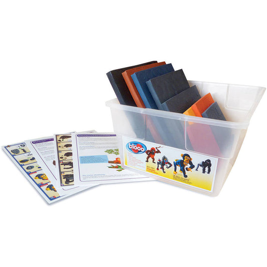 Bloco Toys Educational Primates Building Set with clear plastic storage container holding colored fabric pieces, instruction sheets, and product packaging displ