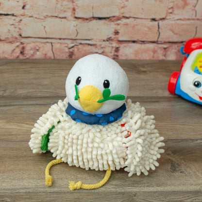 Wee Believers Lil Prayer Buddy Dottie plush toy with white fuzzy body, yellow beak, black eyes, blue polka-dot bandana, and green wings