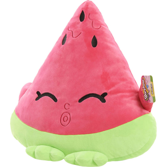 Pink plush Shopkins Melonie Pips character with closed eyes, curved smile, black teardrop markings, and lime-green base with feet details