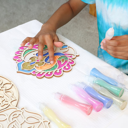 Make Your Own Wooden Rangoli craft kit with colorful paint bottles and decorated wooden pieces