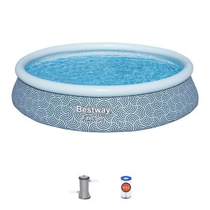 Bestway FastSet inflatable pool with blue and white geometric pattern, filled with water, shown with pump and filter cartridge