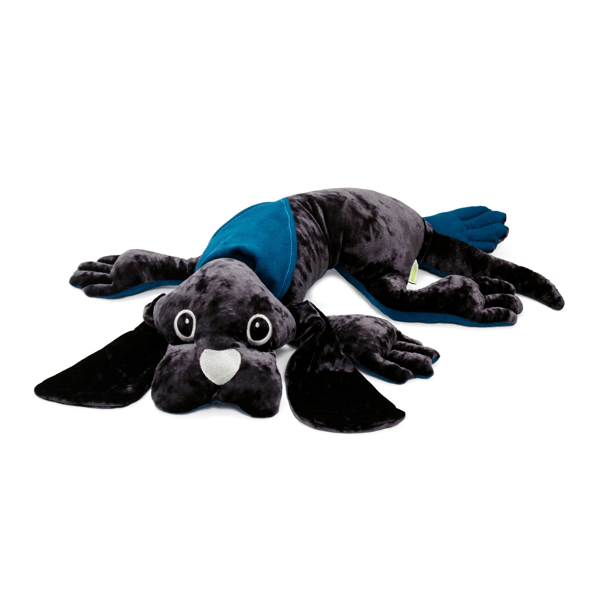 Black plush dog with white eyes and heart nose wearing blue therapeutic weighted wrap, lying flat on white background