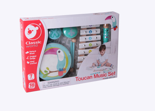 Classic World Toucan Music Set package showing wooden instruments including xylophone, drums, and toucan-shaped shaker, modeled by a child