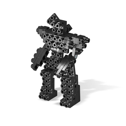 Black modular building set assembled into a robot figure with cylindrical connector pieces forming the body, arms, and legs