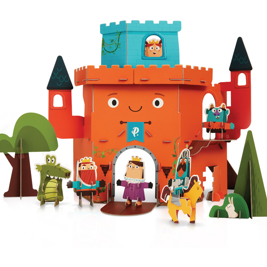 Curious Kingdom Castle Playset with orange cardboard castle structure, turrets with black roofs, character figurines including kings and queens, trees, and anim