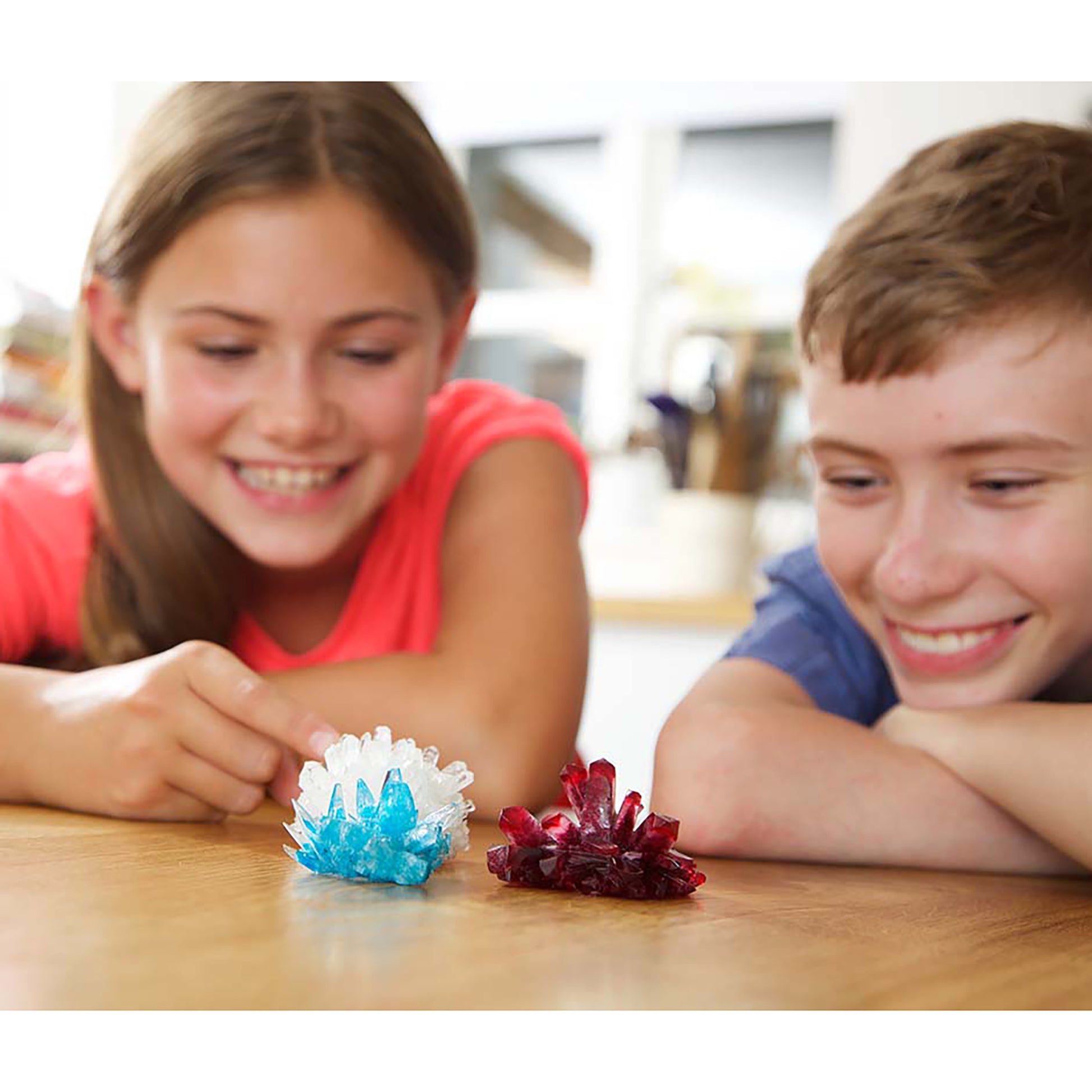 4M Crystal Growing Kit with blue and red crystals displayed, children experimenting with DIY STEM craft