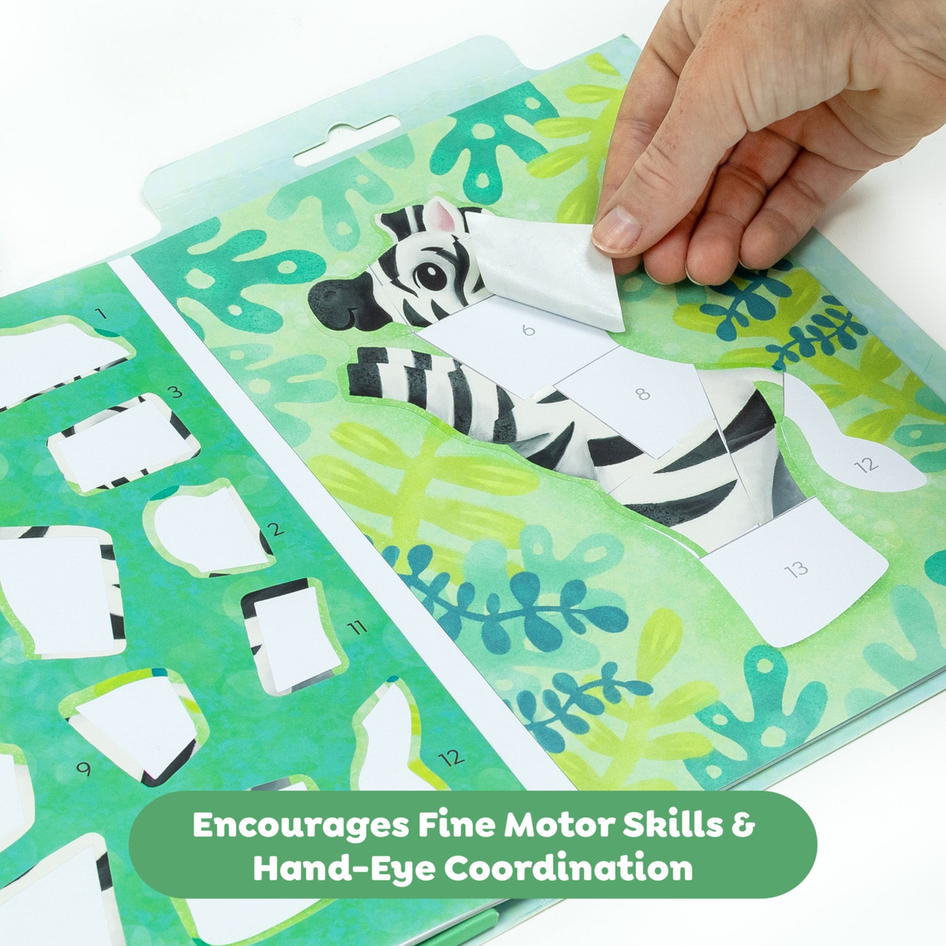 Tiger Tribe Sticker by Numbers Animal Adventure set with green tropical background and zebra sticker being placed