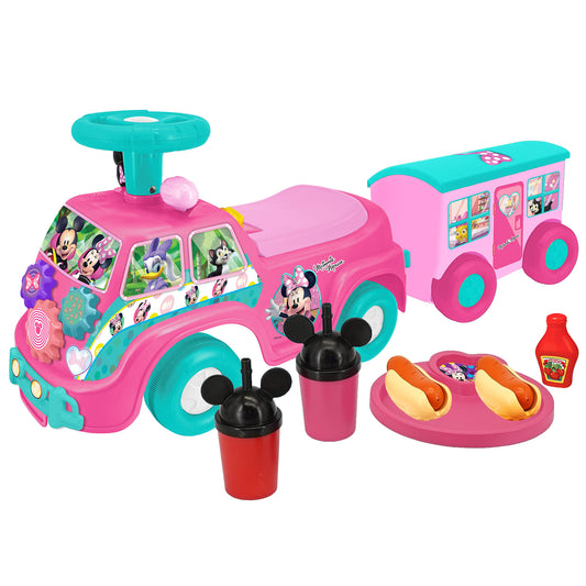 Disney Minnie Mouse pink and turquoise foot-to-floor ride-on camper set with attached trailer, steering wheel, cup holders, pretend food items, and character gr