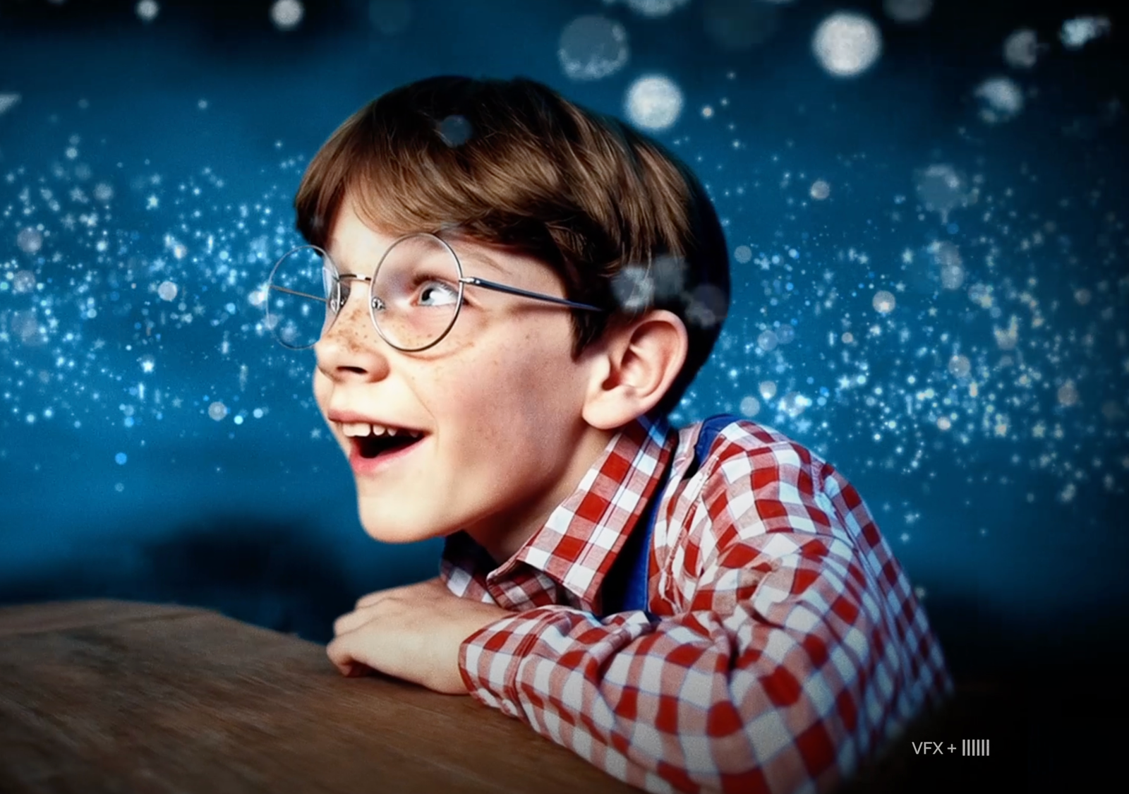 Boy wearing glasses looking around in wonder