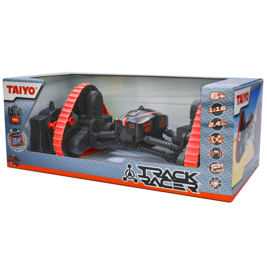 Taiyo Track Racer red and black remote-controlled vehicle with red track sections and wireless controller, displayed in packaging