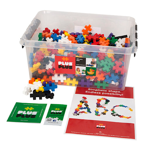 Plus-Plus Big 400-piece building set with colorful plastic plus-shaped blocks in clear container, instruction booklet, and example creations
