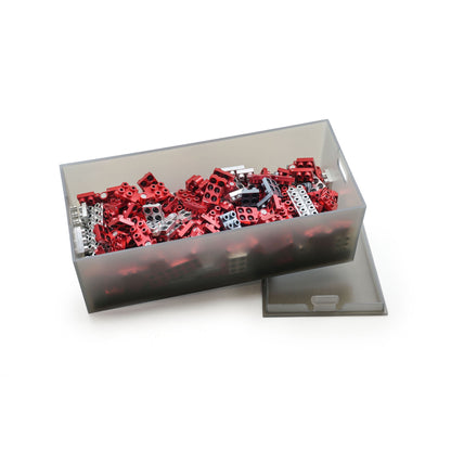 Metomics 3-in-1 Series 001 Ruby Red building set with red and white construction blocks displayed in clear storage organizer box