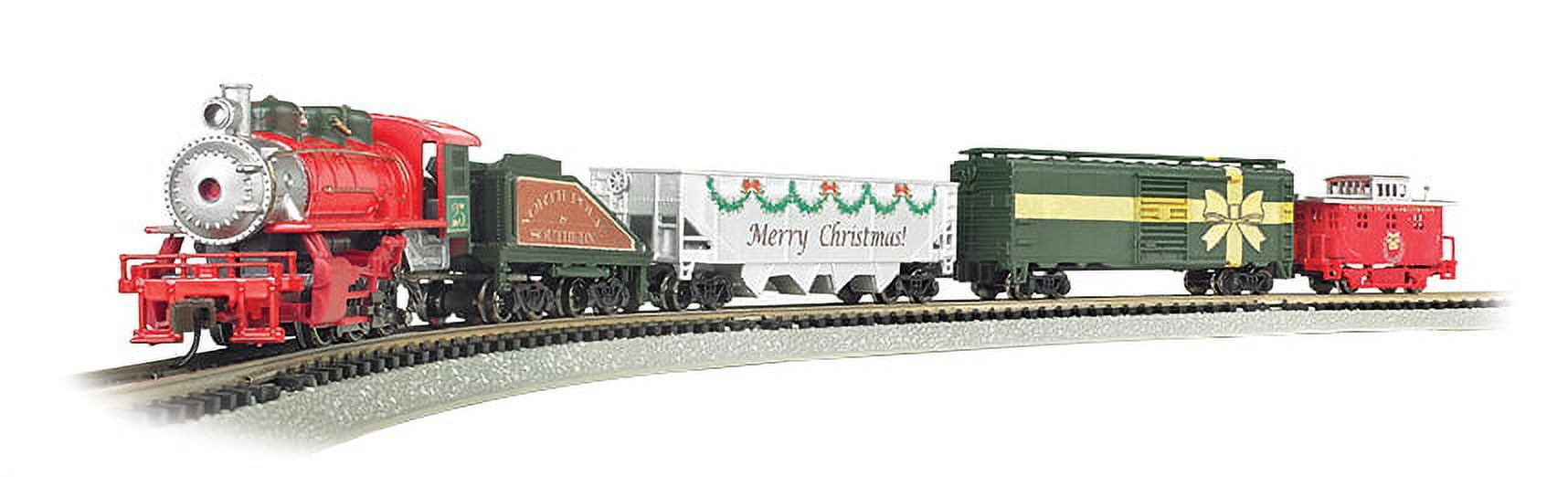 Bachmann Trains Merry Christmas Express N Scale train set with red steam locomotive, green tender car, white passenger car with 'Merry Christmas' text and garla