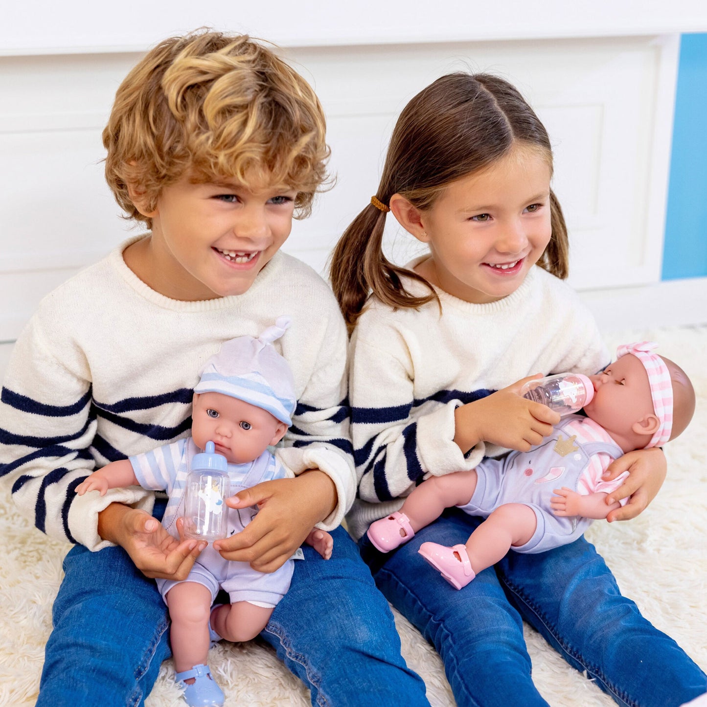 JC Toys Twin Nonis Boutique 15" baby dolls in pink and blue with realistic features and accessories