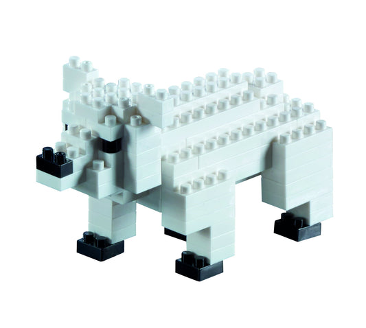 White and black micro-sized building blocks assembled into a polar bear figure with black feet and facial features