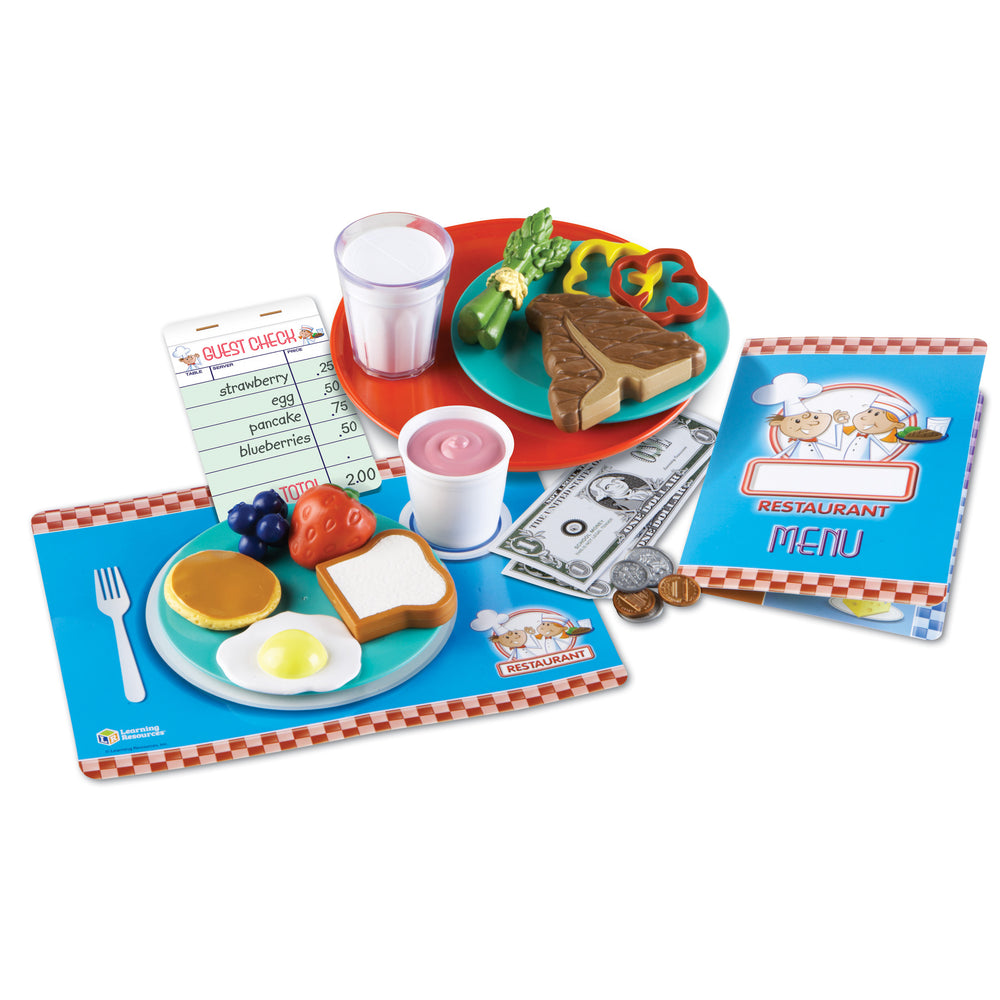Serve It Up! Play Restaurant set with play food items including pancakes, eggs, toast, fruit, a glass of milk, pink yogurt cup, guest check notepad, play money,