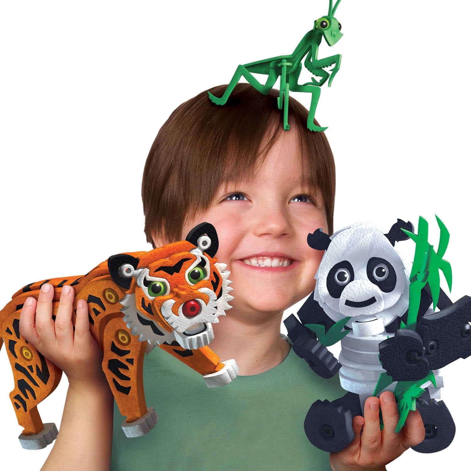 Modeled by a child holding orange tiger, green mantis, and panda plush figures from Bloco Toys 3D construction set