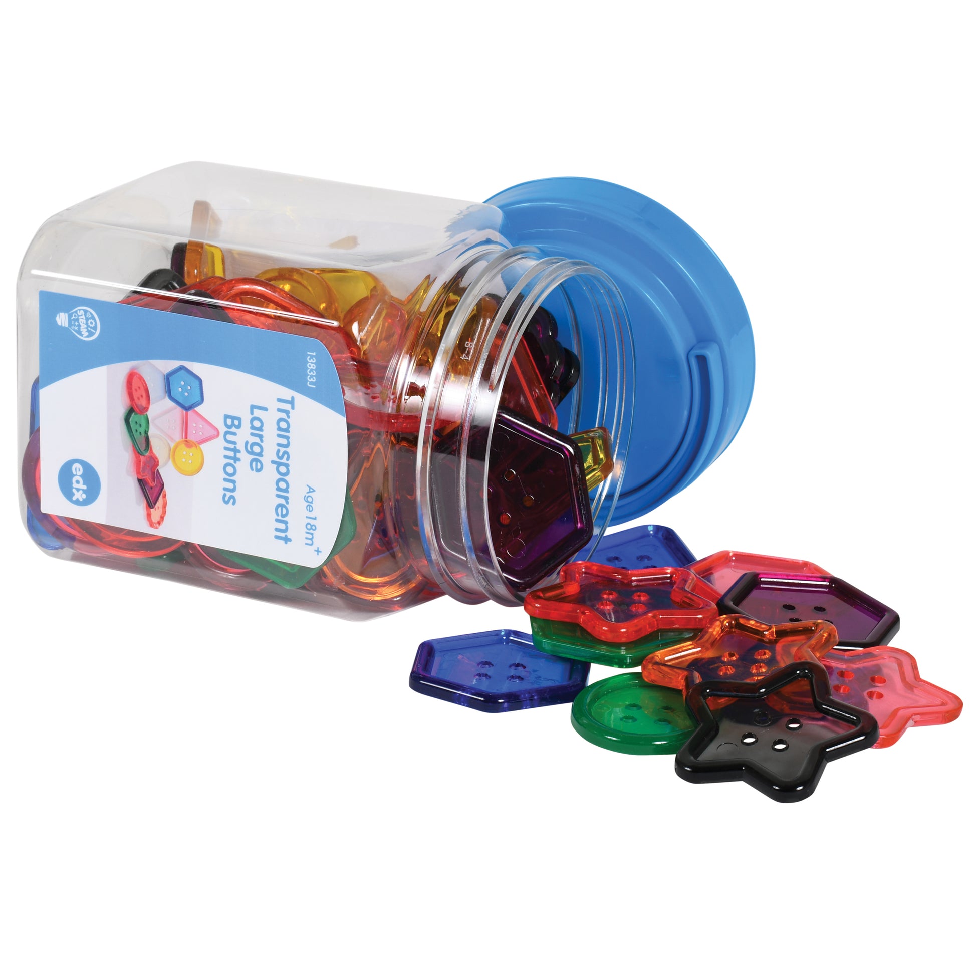Transparent plastic jar with blue lid tipped over, spilling colorful translucent button-shaped pieces in red, blue, green, orange, purple, and black onto white