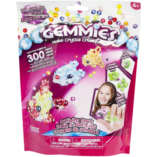 Gemmies Make Crystal Creations Activity Pack with 300+ colorful crystal beads, modeled by a child holding finished crystal creations