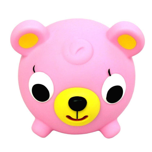 Pink plush bear toy with yellow nose and ears, large white eyes with black pupils, and a smiling expression
