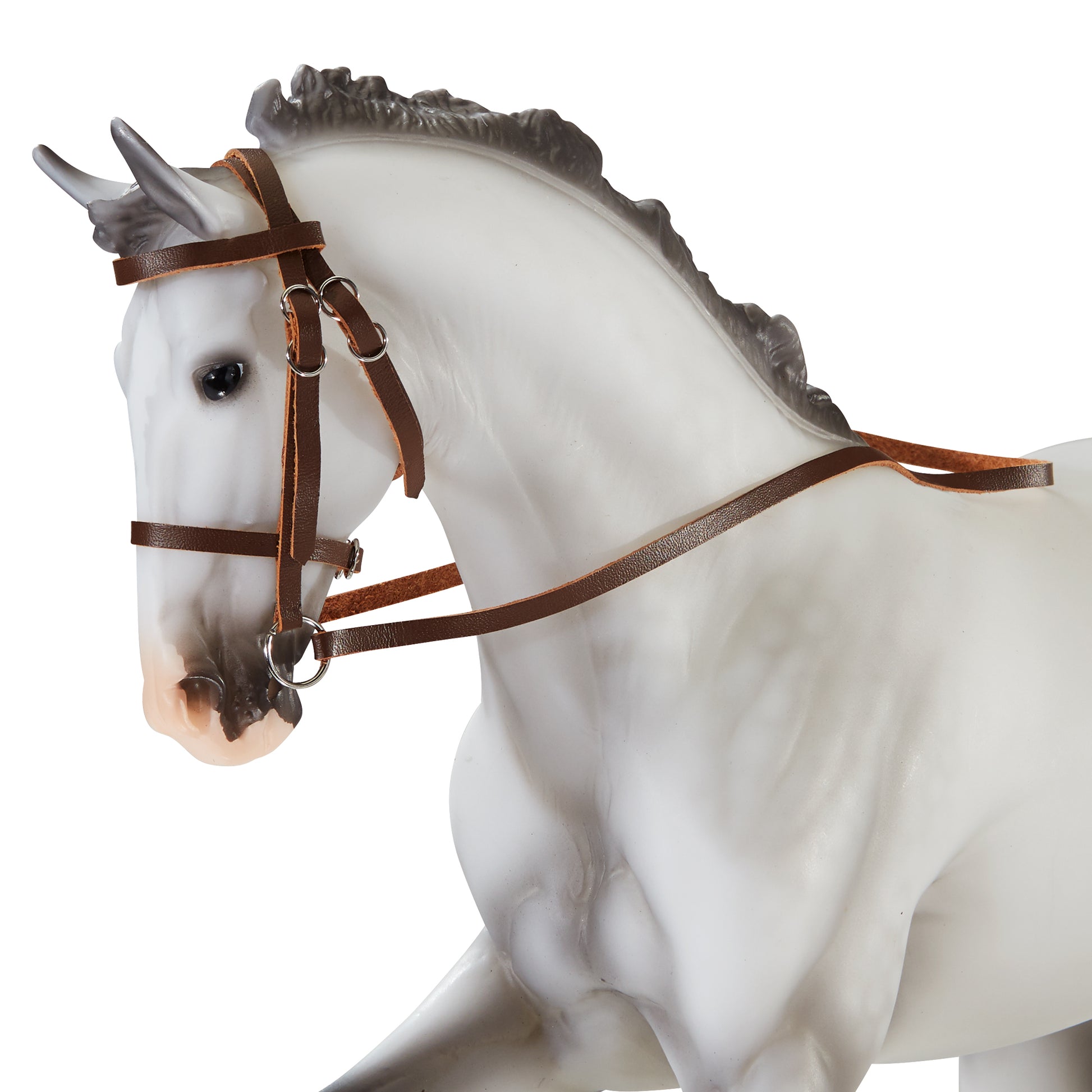 White horse figurine with dark gray mane wearing brown leather hunter/jumper bridle with snaffle design