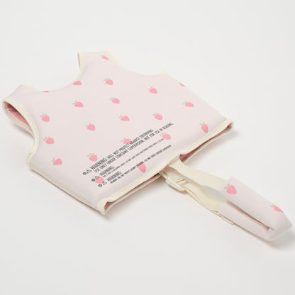 Sunnylife Kids Swim Vest in pink with strawberry pattern and cream safety strap