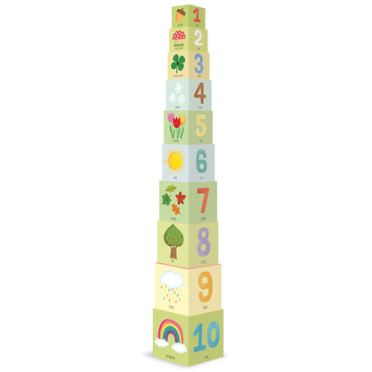 Stacked wooden cubes numbered 1-10 with colorful illustrations of acorn, mushroom, clover, snowflakes, tulips, sun, leaves, tree, rain cloud, and rainbow