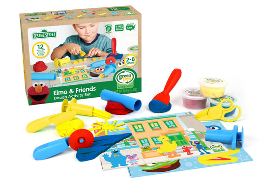 Sesame Street Elmo & Friends Dough Activity Set with 12 pieces including colorful dough, play mat, and plastic tools, modeled by a child