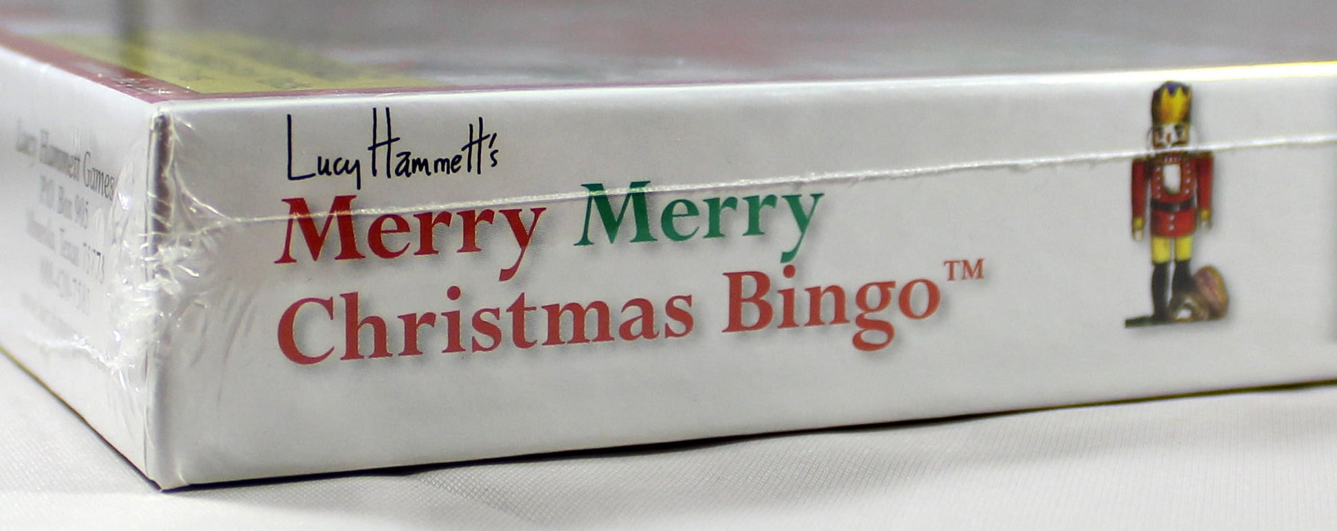 Lucy Hammett's Merry Merry Christmas Bingo board game box with red and green text and nutcracker illustration