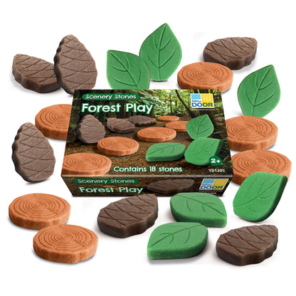 Yellow Door Forest Play Scenery Stones set with 18 foam pieces including brown tree log slices, gray bark-textured stones, and green leaf-shaped pieces arranged
