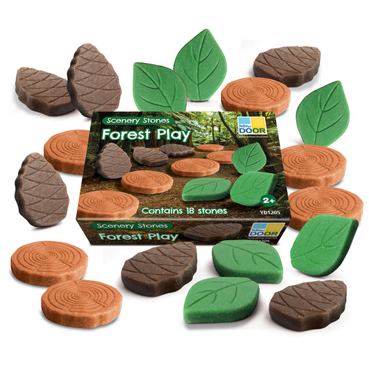 Yellow Door Forest Play Scenery Stones set with 18 foam pieces including brown tree log slices, gray bark-textured stones, and green leaf-shaped pieces arranged