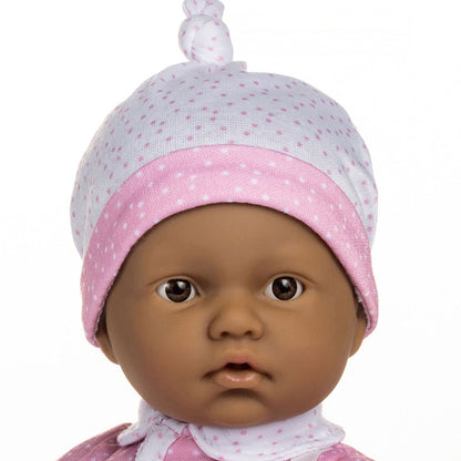 JC Toys La Baby Hispanic doll wearing pink and white outfit with matching hat