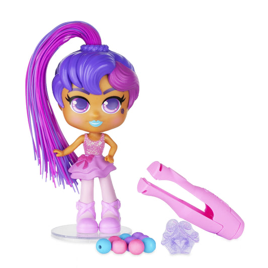 CurliGirls Hayli the Ballerina doll with purple and magenta hair, yellow skin, large purple eyes, sparkly pink top, and pink tutu, shown with curling hair tool,