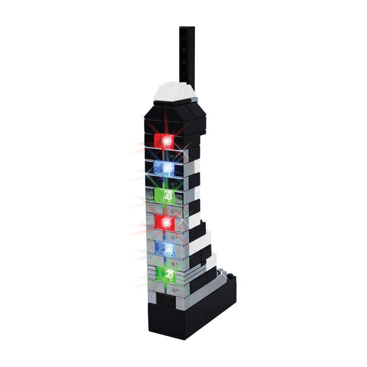 E-blox Power Blox Metallic stacked building blocks tower with illuminated red, blue, and green LED lights and labeled function buttons, white cap on top