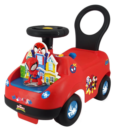 Red ride-on toy car with black steering wheel and handle, featuring Spider-Man character, house graphics, and blue web-design wheels
